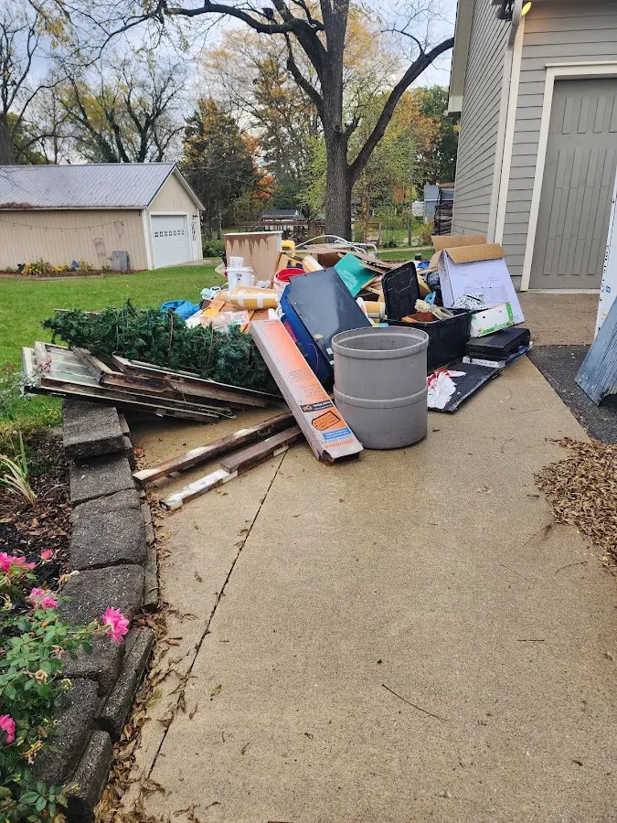 Dumpster being loaded with debris for Estate Cleanout Dumpster Rental in Palos Park